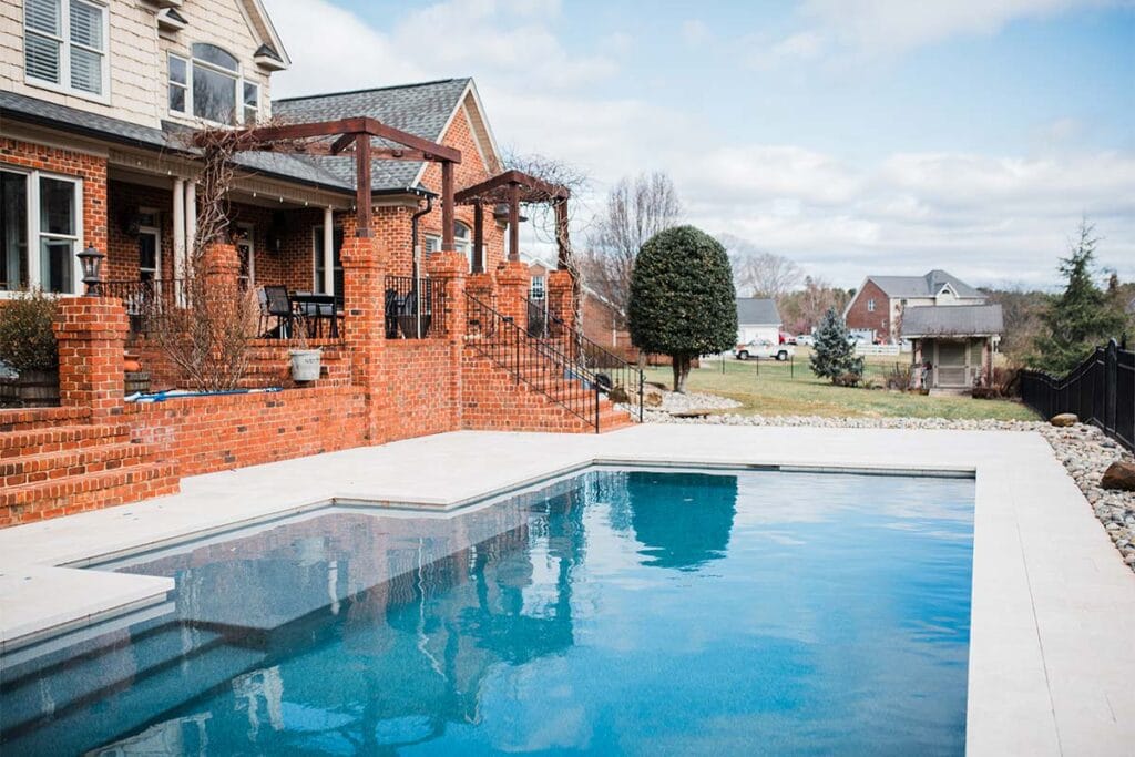 Wide shot of brown summit project with pool in the center of the frame in Raleigh, North Carolina