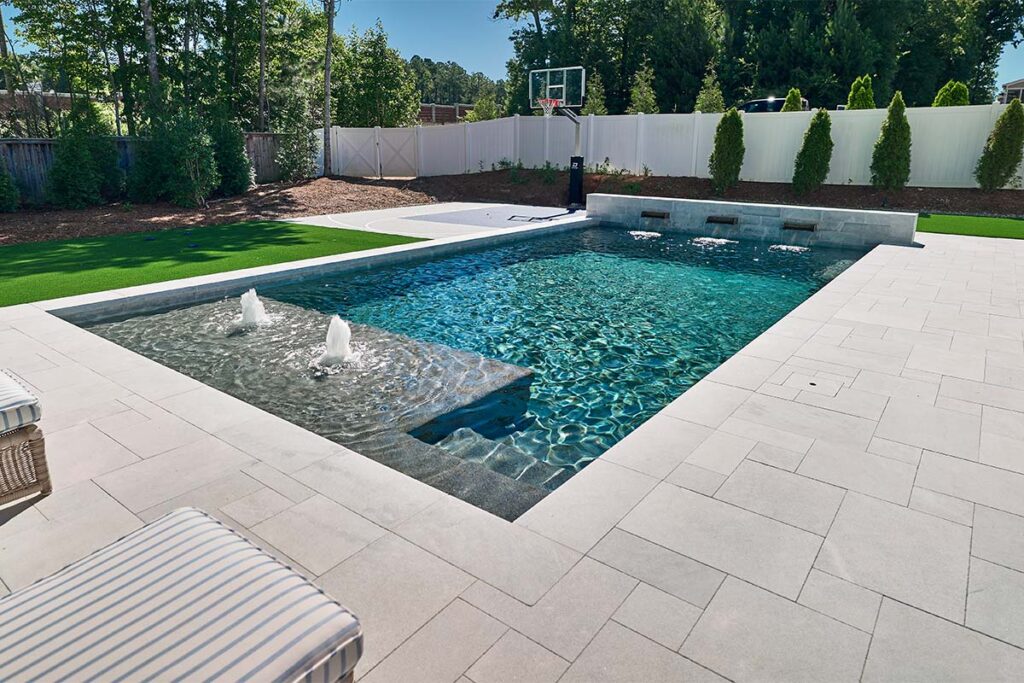 Contemporary Apex pool with water jets and water fall