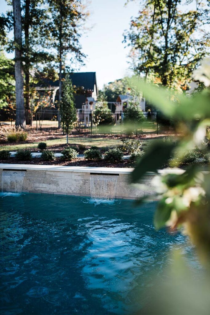 Contemporary Raleigh featuring concreate pool and raised wall