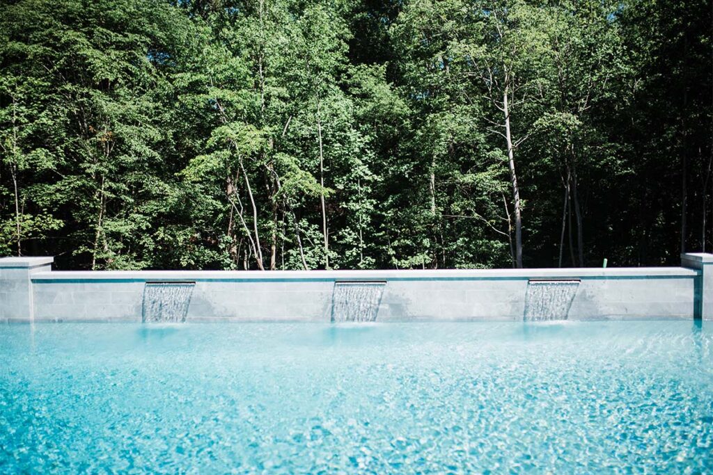 Wide shot of Formal Cary retaining wall with built in water fall
