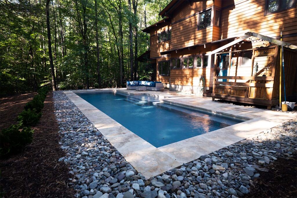 Custom Concrete pool in Chapel Hill, NC. Rustic Chapel Hill features custom concrete pool design