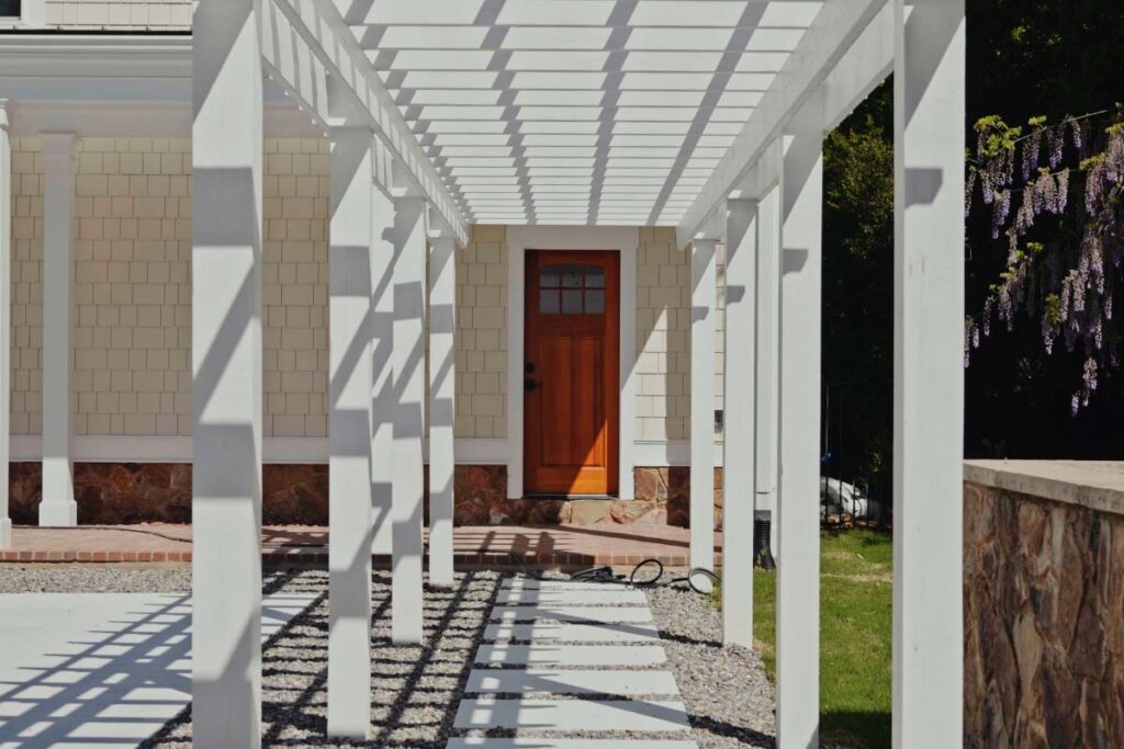Custom Concrete pool in Pinehurst NC. Pinehurst Contemporary features custom pavilion design and walkway